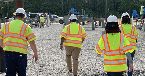 four employees at a work site