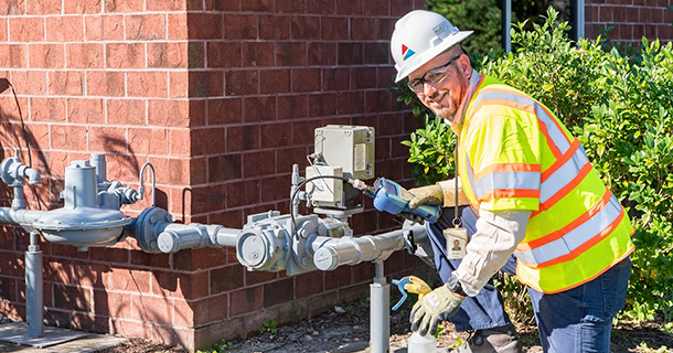 man leaning over meter