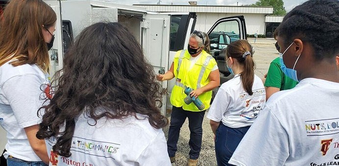 Nicor Gas employee teaches Camp Gadget program students what she does in the field.